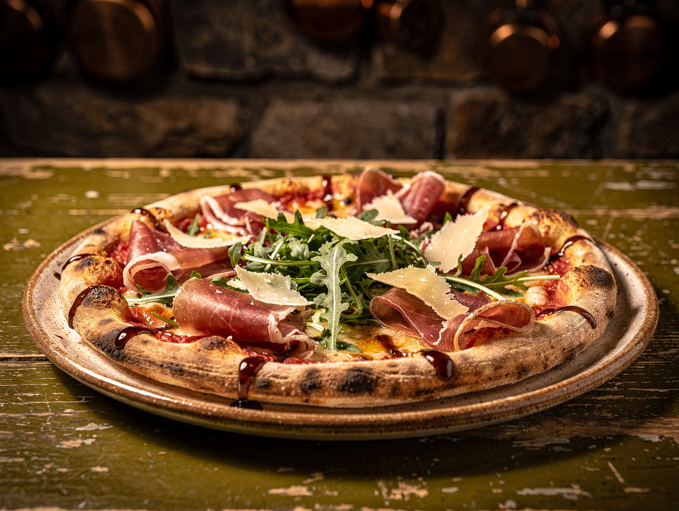 Wood oven pizza topped with burrata and prosciutto